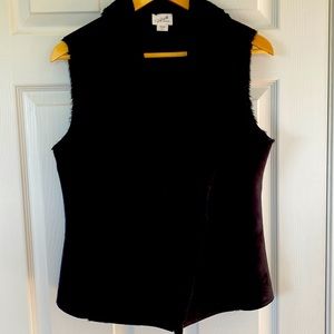 Black suede cloth vest with faux fur lining. Nicely fitted. Lightweight, pockets